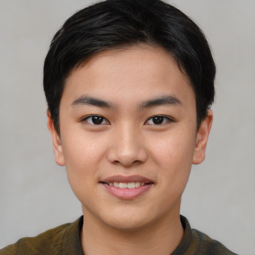Joyful asian young-adult male with short  black hair and brown eyes