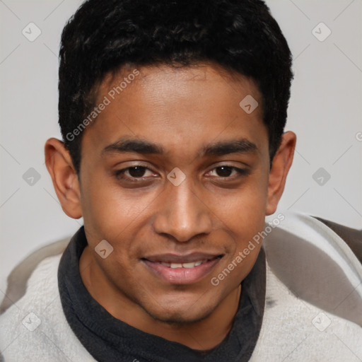 Joyful black young-adult male with short  brown hair and brown eyes