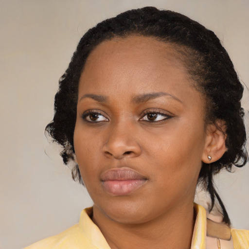 Neutral black young-adult female with medium  black hair and brown eyes