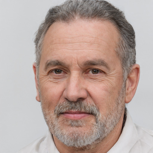 Joyful white middle-aged male with short  gray hair and brown eyes