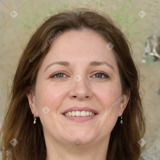 Joyful white adult female with long  brown hair and green eyes