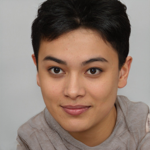 Joyful asian young-adult female with short  brown hair and brown eyes