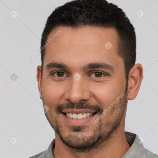 Joyful white young-adult male with short  brown hair and brown eyes