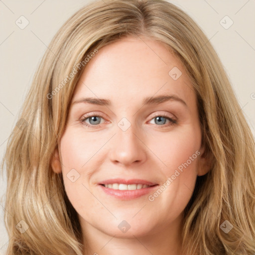 Joyful white young-adult female with long  brown hair and blue eyes