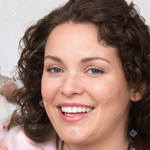 Joyful white young-adult female with medium  brown hair and green eyes