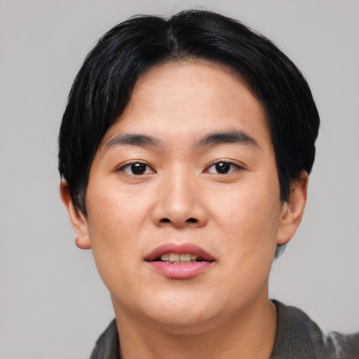 Joyful asian young-adult male with short  black hair and brown eyes