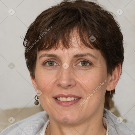 Joyful white adult female with short  brown hair and grey eyes