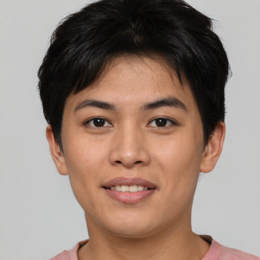 Joyful asian young-adult male with short  brown hair and brown eyes