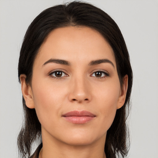 Joyful white young-adult female with medium  brown hair and brown eyes