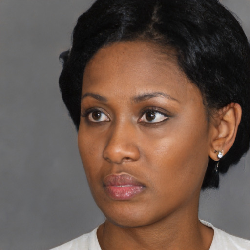 Neutral black young-adult female with short  black hair and brown eyes