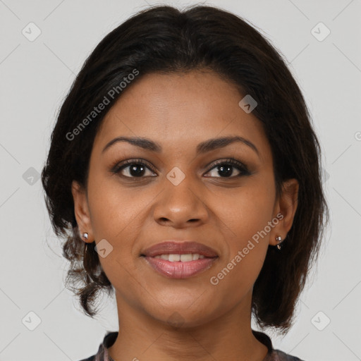 Joyful black young-adult female with medium  brown hair and brown eyes