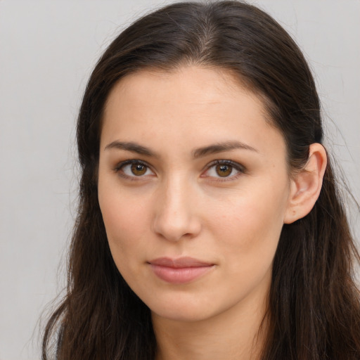 Neutral white young-adult female with long  brown hair and brown eyes