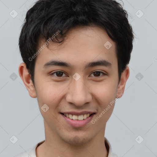 Joyful asian young-adult male with short  brown hair and brown eyes