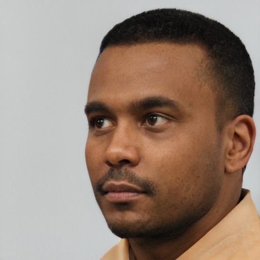 Neutral black young-adult male with short  black hair and brown eyes