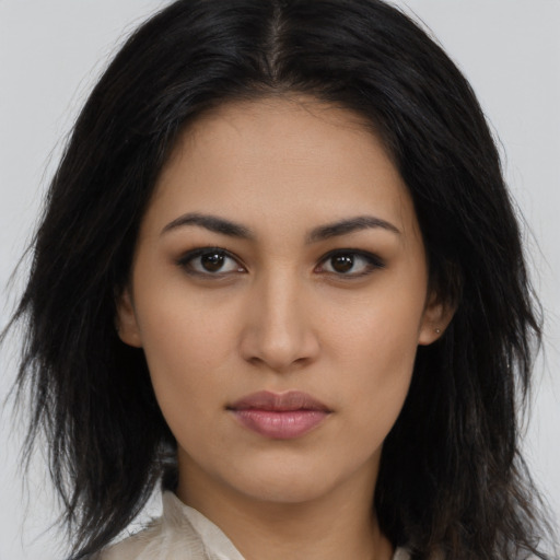 Neutral latino young-adult female with long  brown hair and brown eyes