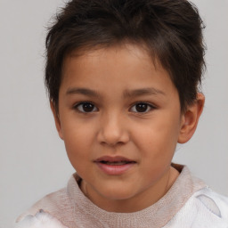 Joyful white child female with short  brown hair and brown eyes