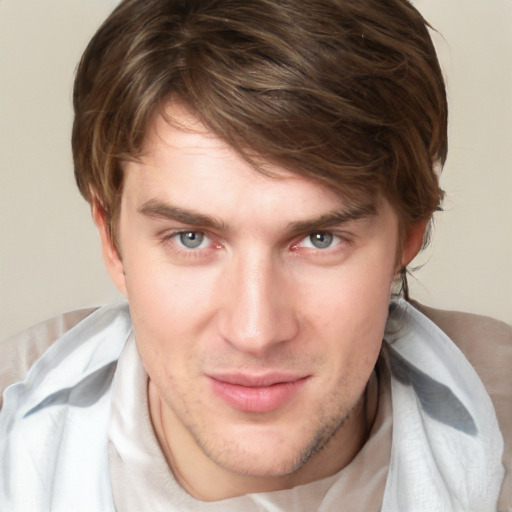 Joyful white young-adult male with short  brown hair and blue eyes