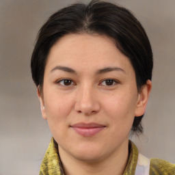 Joyful white adult female with medium  brown hair and brown eyes