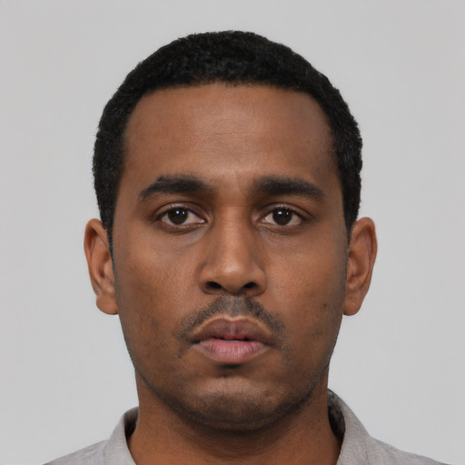 Neutral black young-adult male with short  black hair and brown eyes