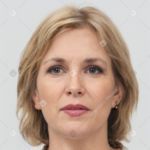 Joyful white adult female with medium  brown hair and brown eyes