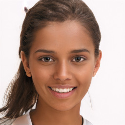 Joyful white child female with medium  brown hair and brown eyes