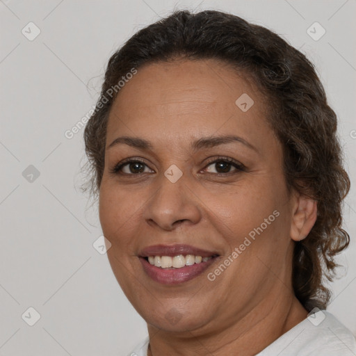 Joyful white adult female with medium  brown hair and brown eyes