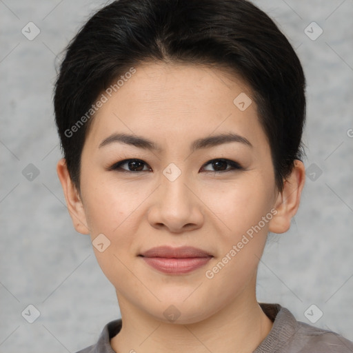 Joyful asian young-adult female with short  brown hair and brown eyes