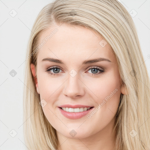 Joyful white young-adult female with long  brown hair and blue eyes