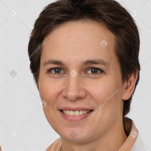 Joyful white adult female with short  brown hair and brown eyes