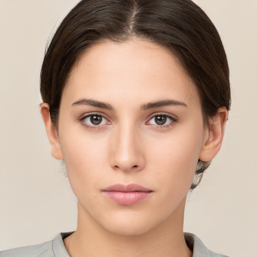 Neutral white young-adult female with medium  brown hair and brown eyes