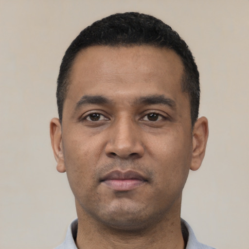 Neutral latino young-adult male with short  black hair and brown eyes