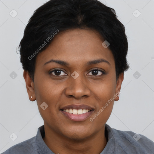 Joyful black young-adult female with short  black hair and brown eyes