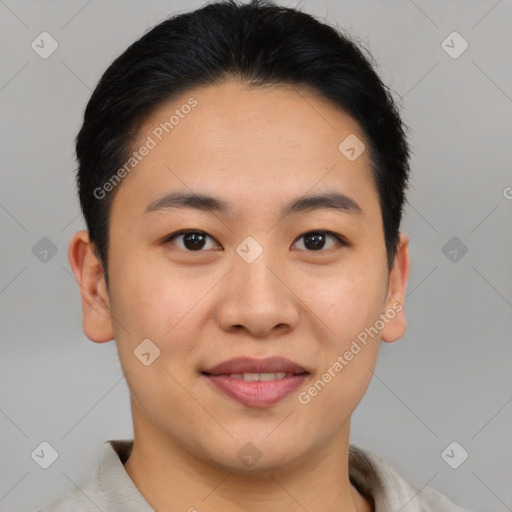 Joyful asian young-adult male with short  brown hair and brown eyes