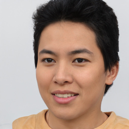 Joyful asian young-adult female with short  brown hair and brown eyes