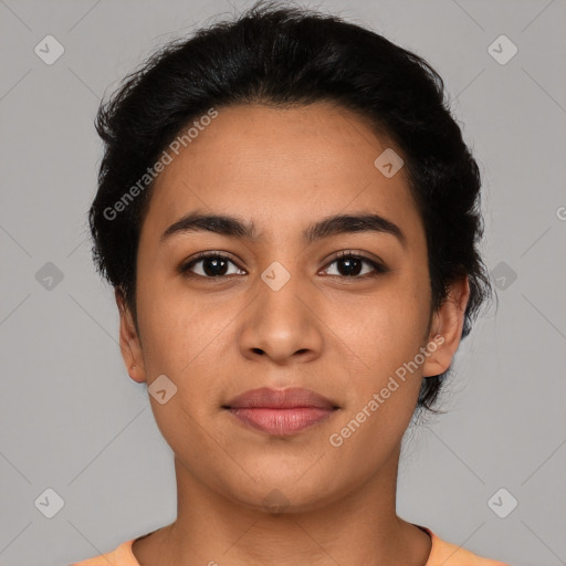 Joyful latino young-adult female with short  brown hair and brown eyes