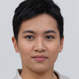 Joyful asian young-adult female with short  brown hair and brown eyes