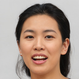 Joyful asian young-adult female with medium  brown hair and brown eyes