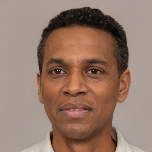 Neutral latino adult male with short  black hair and brown eyes