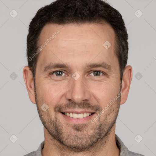 Joyful white adult male with short  brown hair and brown eyes