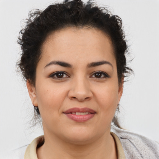 Joyful latino young-adult female with short  brown hair and brown eyes