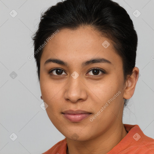 Joyful latino young-adult female with medium  brown hair and brown eyes