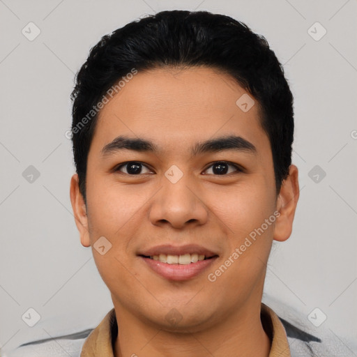 Joyful asian young-adult male with short  black hair and brown eyes