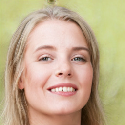 Joyful white young-adult female with long  brown hair and blue eyes