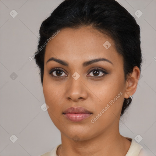 Joyful latino young-adult female with short  brown hair and brown eyes