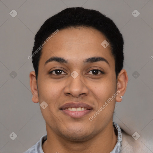 Joyful latino young-adult male with short  black hair and brown eyes