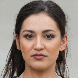 Joyful white young-adult female with medium  brown hair and brown eyes