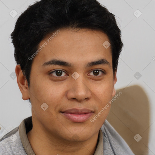 Joyful latino young-adult male with short  brown hair and brown eyes