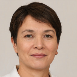 Joyful white adult female with short  brown hair and brown eyes