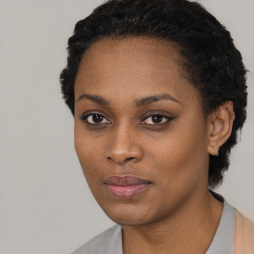 Neutral black young-adult female with short  black hair and brown eyes