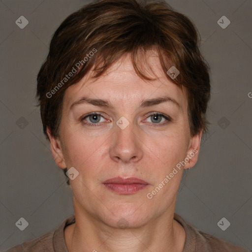 Joyful white adult female with short  brown hair and brown eyes